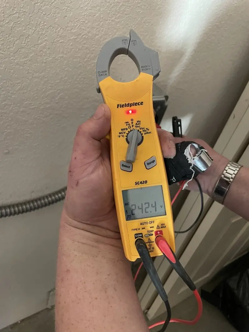 Voltage testing with clamp meter during Electrical Installation Services in Hill 'n Dale